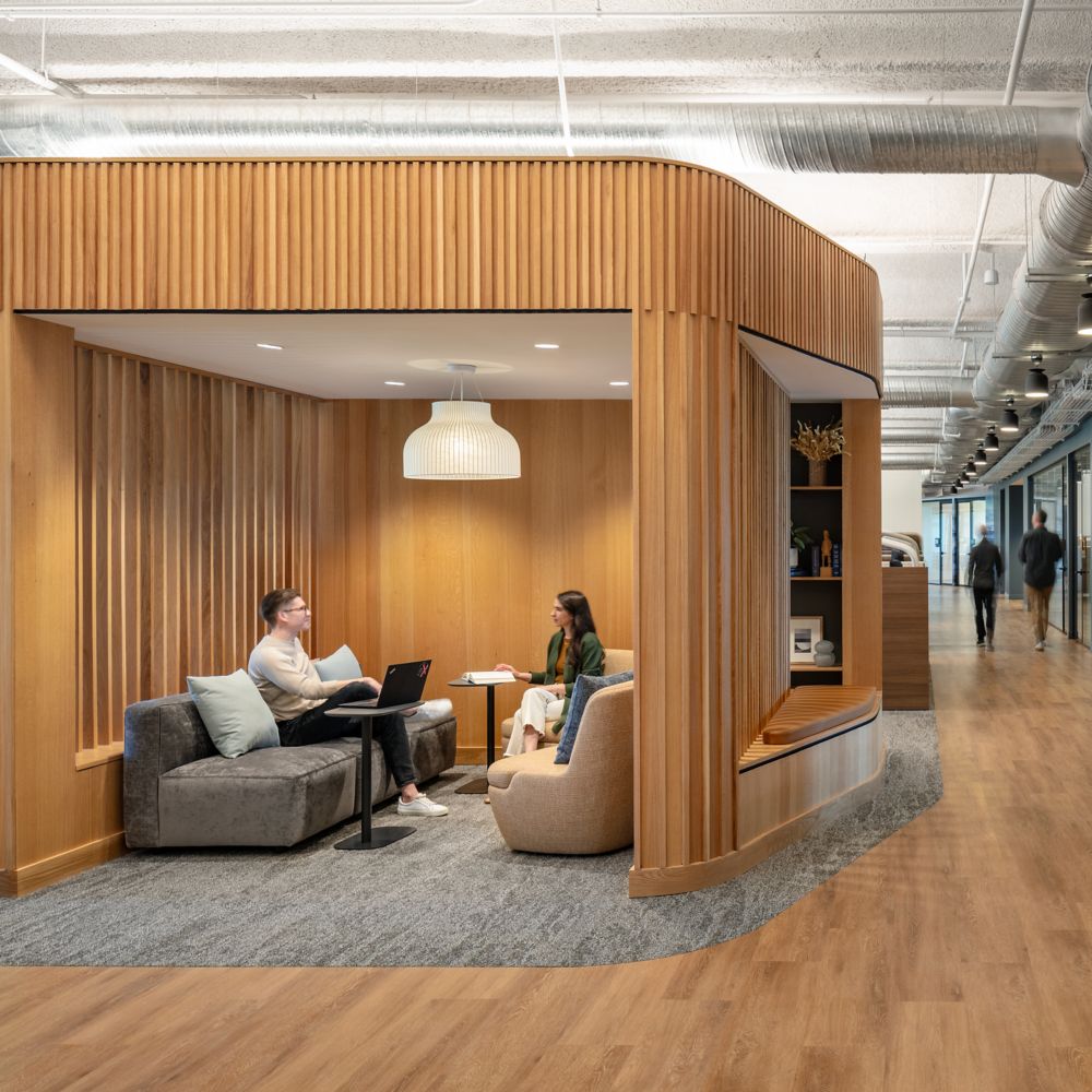 Interface Rock Springs plank carpet tile in workplace meeting area and open office with Textured Woodgrains plank LVT in corridors